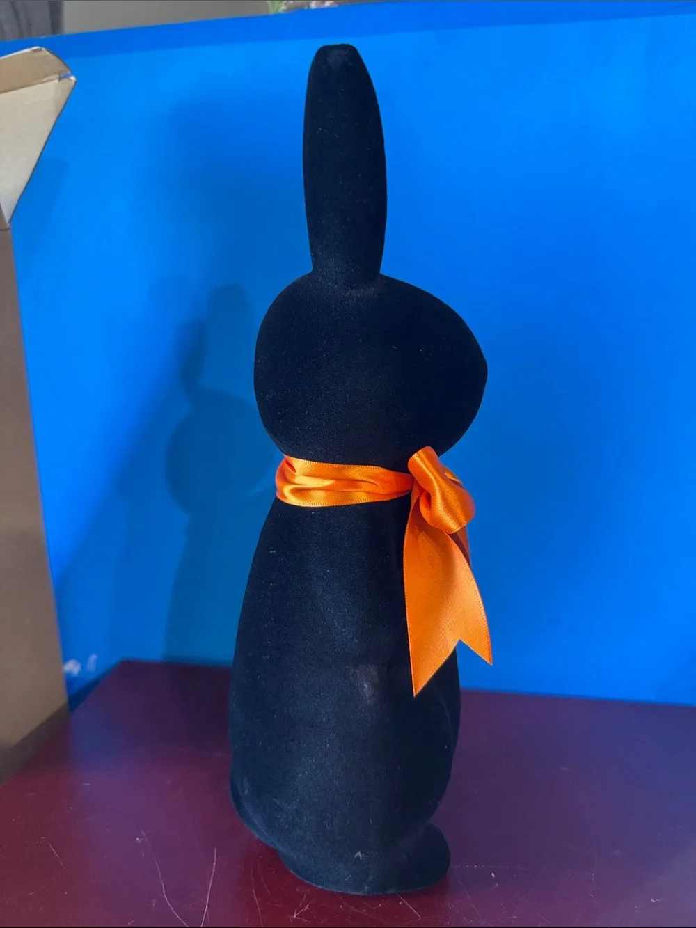 Black flocked (fuzzy) bunny figurine w/orange bow contemporary Easter- NEW
